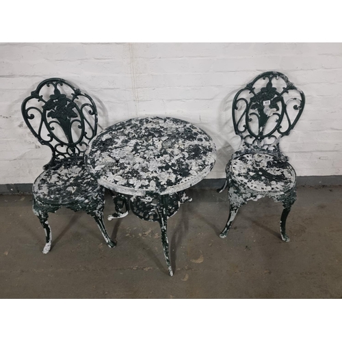 405 - A metal garden table and 2 chairs