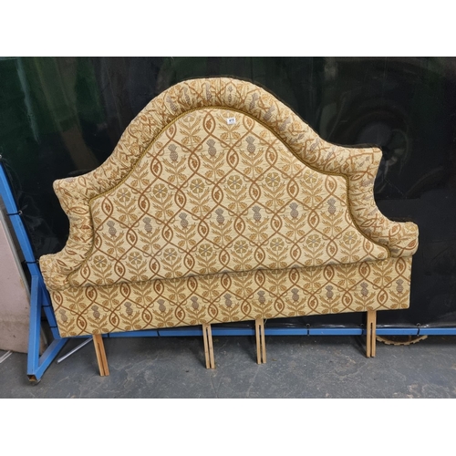 415 - An upholstered double headboard