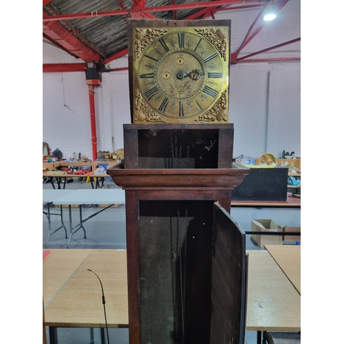 70 - An oak cased Stringer of Stockport Grandfather clock with pendulum and weight