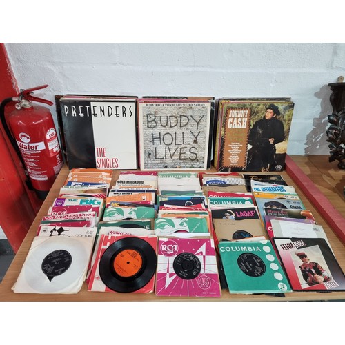 1 - A collection of vinyl records and singles including Beatles, Status Quo, Beach Boys, etc