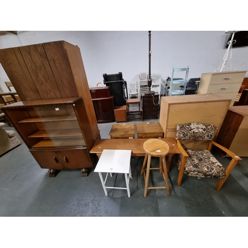 563 - A pine bench, pine stool, side table, an oak glass front bookcase, etc