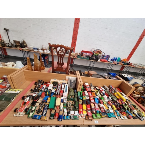 32 - A collection of playworn diecast model cars