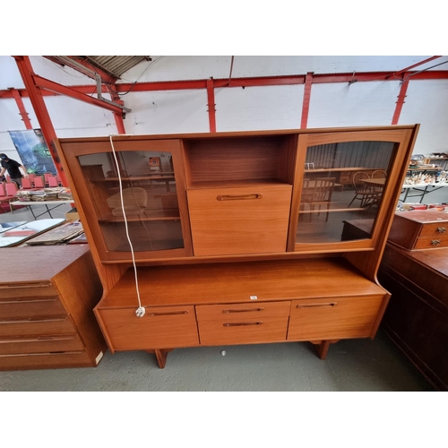 102 - A teak portwood highboard