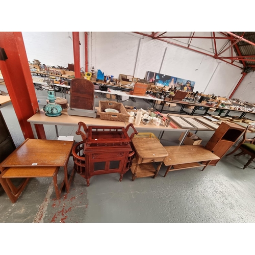 109 - A teak nest of tables, coffee table, pot cupboard, Ercol side table and a drinks cabinet