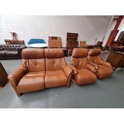 115 - A Himolla brown leather reclining two seater sofa and two reclining swivel armchairs