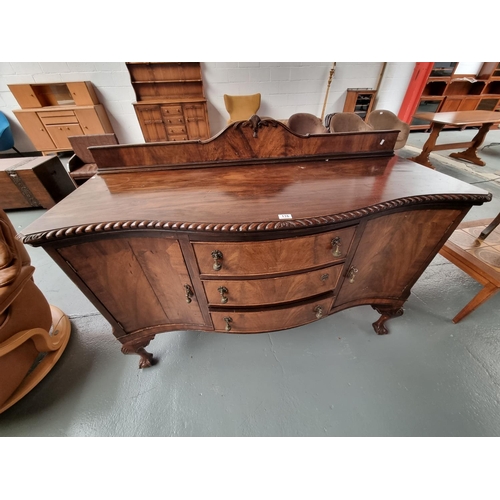 116 - A mahogany serpentine fronted sideboard