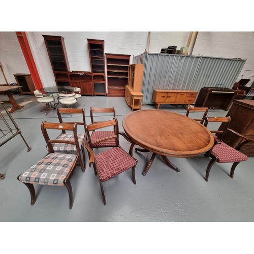 118 - A circular dining table on a tripod base and six Regency style dining chairs upholstered in fabric f... 