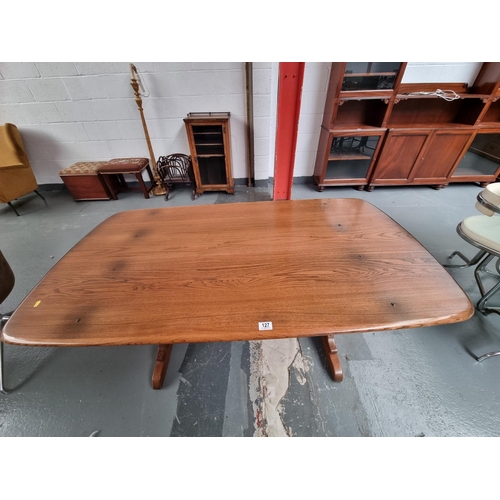 127 - An Ercol plank top dining table