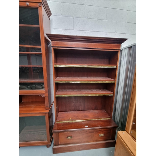 145 - A mahogany bookcase with single drawer and adjustable shelves