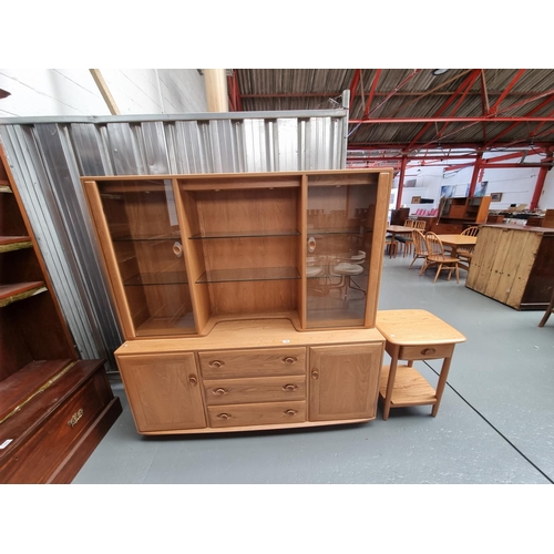 146 - An Ercol sideboard and top and an Ercol side table