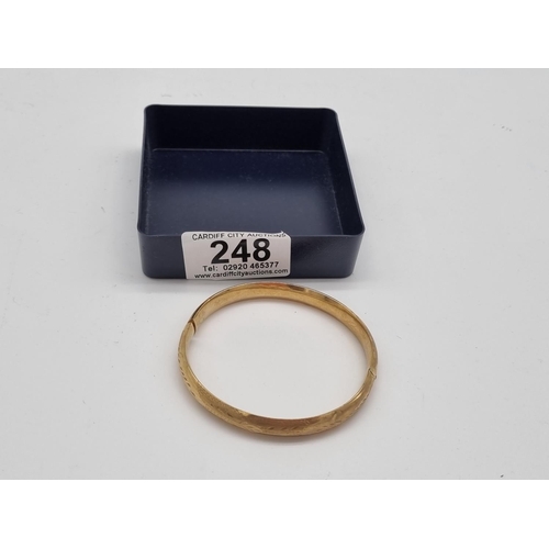 248 - A 9k gold bangle (needs repair) - 8.5 grams (XRF tested to 9k)