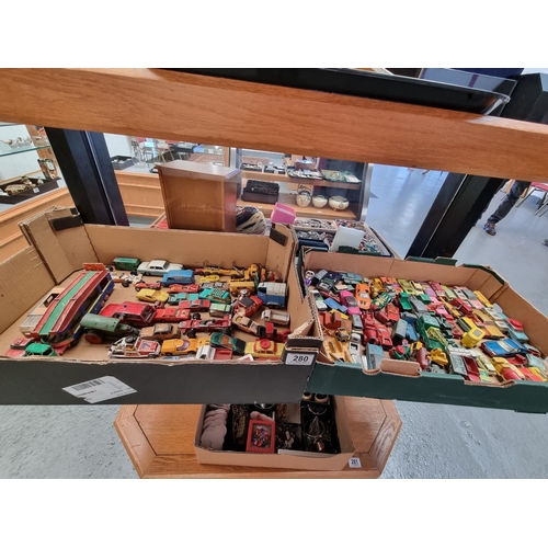 280 - Two trays of early playworn diecast model cars to include Dinky, Corgi, Lesney, etc