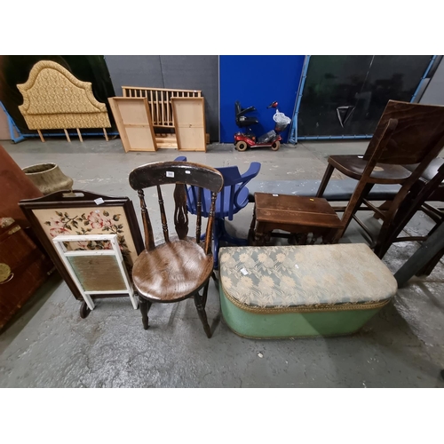 580 - An oak chair, an oak fireguard, ottoman, etc