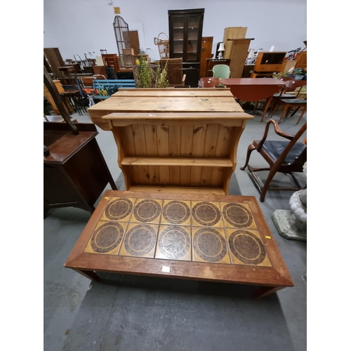 603 - A teak tile top table and a pine wall shelf