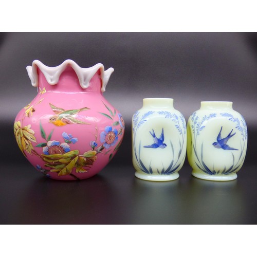 8 - Three Victorian vases with hand painted enamel birds to include pink vase with tooled rim and a pair... 