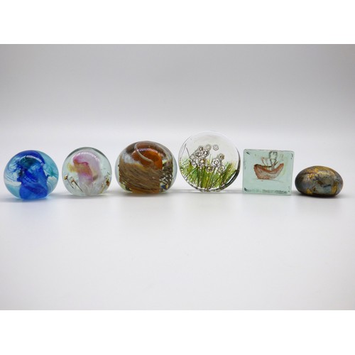 82 - Isle of Wight Studio Glass five paperweights and a pen holder.
Three with impressed flame mark, thre... 