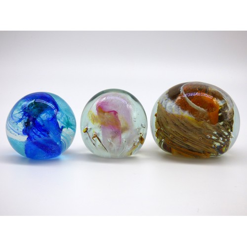 82 - Isle of Wight Studio Glass five paperweights and a pen holder.
Three with impressed flame mark, thre... 