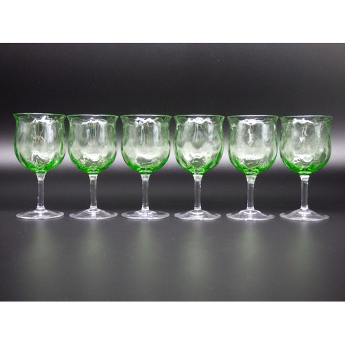 83 - A set of six green uranium wine glasses with optic coin dot, circa 1900.
Height 12.5cm