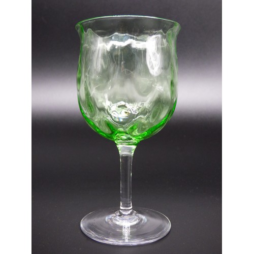 83 - A set of six green uranium wine glasses with optic coin dot, circa 1900.
Height 12.5cm