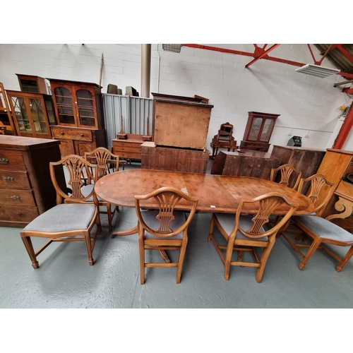 125 - A twin pedestal dining table with six chairs and one extra leaf