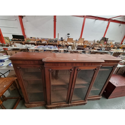 102 - A mahogany Victorian break fronted bookcase