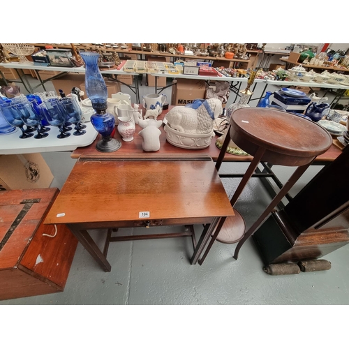 104 - An oak hall table with single drawer and a plant stand