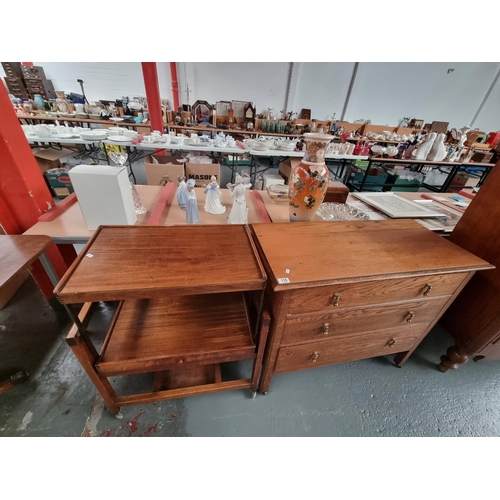 110 - An oak three drawer chest of drawers and a metamorphic table