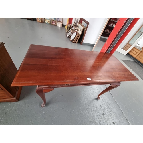 129 - A two drawer writing desk on cabriole legs