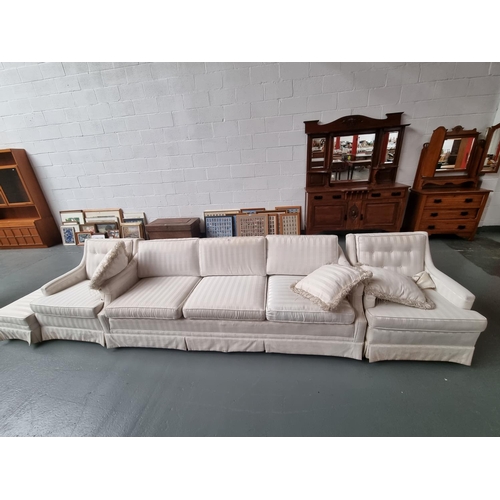 142 - A striped fabric three seater sofa with two matching armchairs, stool and scatter cushions