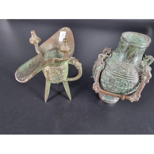 206 - Two bronze Chinese pieces - a wine pourer/cup- and a wine container