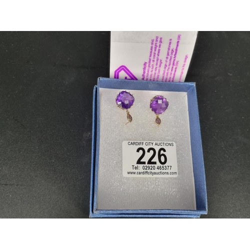 226 - A pair of pierced earrings - amethyst and 9k gold