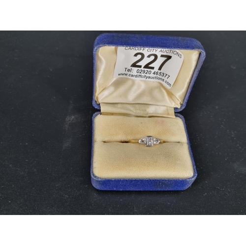 227 - An 18k gold and diamond engagement ring - 4 stone