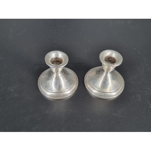 233 - A pair of Sterling Silver weighted dwarf candlesticks - 3 inches tall (weight including weighting is... 