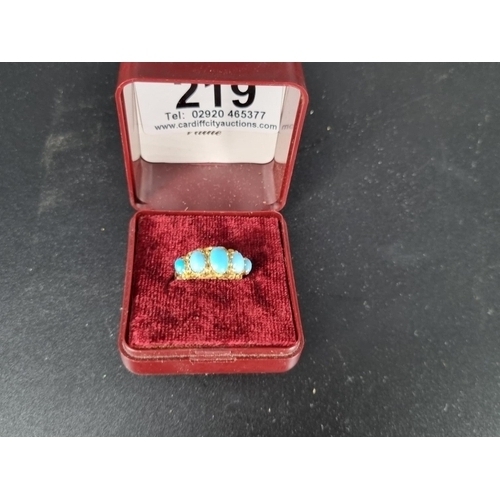 219 - A 9k gold ring with 5 turquoise stones (total weight 1.5 grams)