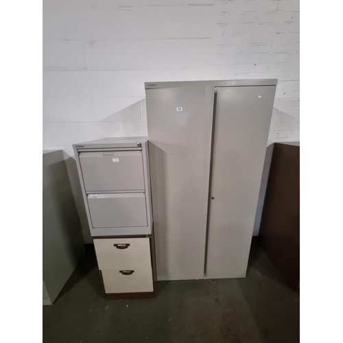 303 - A 2 door Bisley metal office cabinet and 2 x 2 drawer filing cabinets