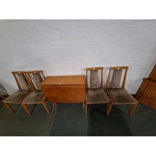 310 - A teak drop leaf dining table and 4 chairs