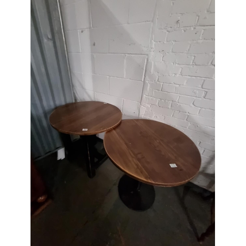 315 - An oak table on metal base and an oak table on wooden legs