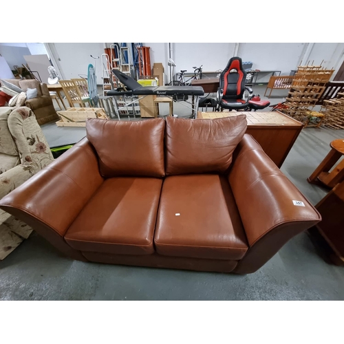 347 - A brown leather 2 seater sofa