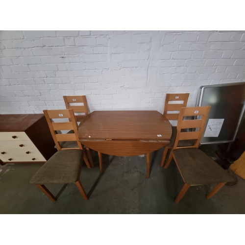 446 - A drop leaf dining table and four chairs