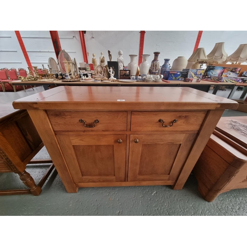 97 - A modern solid oak sideboard