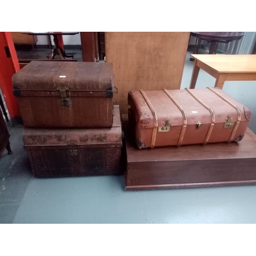 120 - Two tin trunks, wooden based travel trunk and a large mahogany storage box