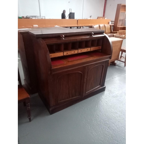 133 - A mahogany roll top desk