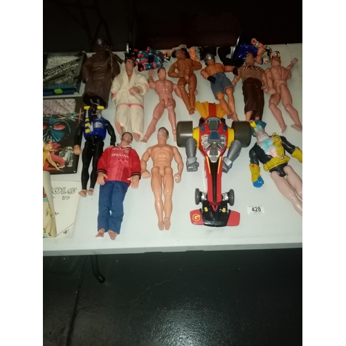 428 - A selection of action figures to include Action Man, Star Wars annual, etc