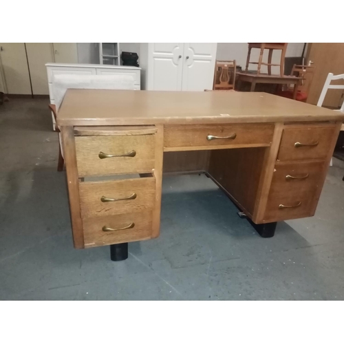 466 - An oak twin pedestal desk