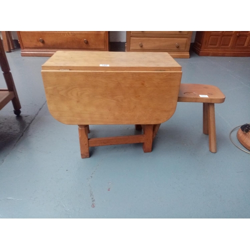 142 - A Beaverman drop leaf twist top table and a Beaverman footstool
By Colin 