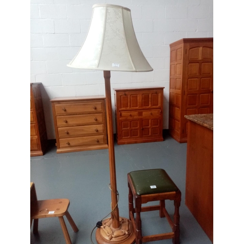 143 - A Beaverman oak floor standing lamp and a Beaverman stool
By Colin 