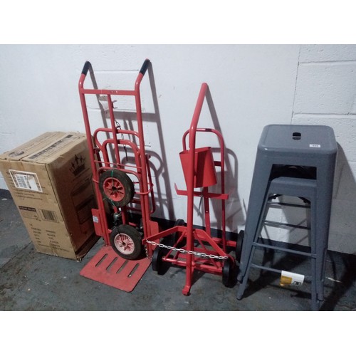 489 - A portable gas heater, 2 x stools and 3 stack trucks