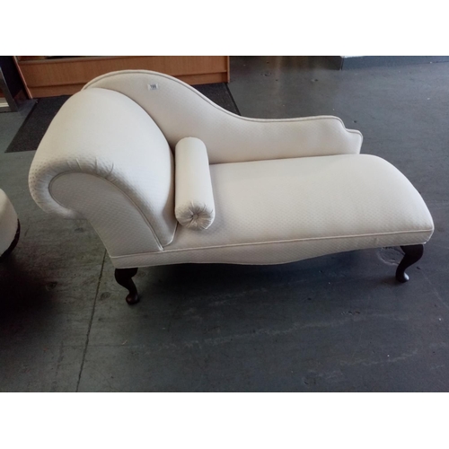 A modern cream chaise lounge
