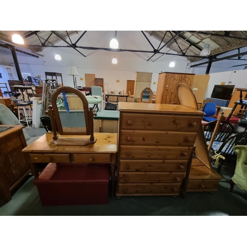 315 - Pine furniture to include a chest of drawers, a desk, cheval mirror, etc