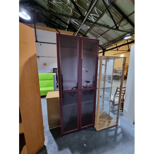 328 - A mahogany glass display cabinet and a pine effect glass display cabinet, etc